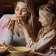 Mom eating her daughter's pizza at Ruby's Pizzeria & Grill